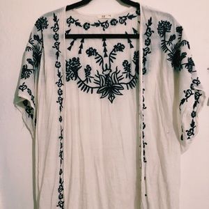 White flowing cover shaw